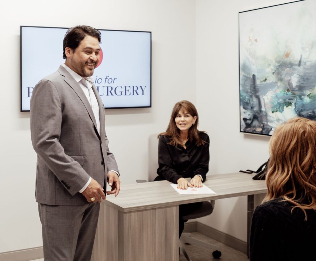 Dr. Bedolla in a patient consultation with a staff member