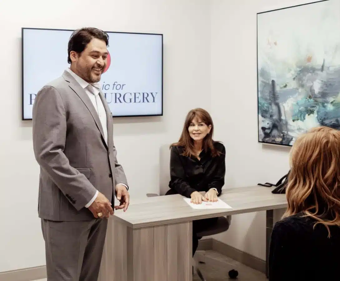 doctor talking and smiling with staff doctor talking and smiling with staff